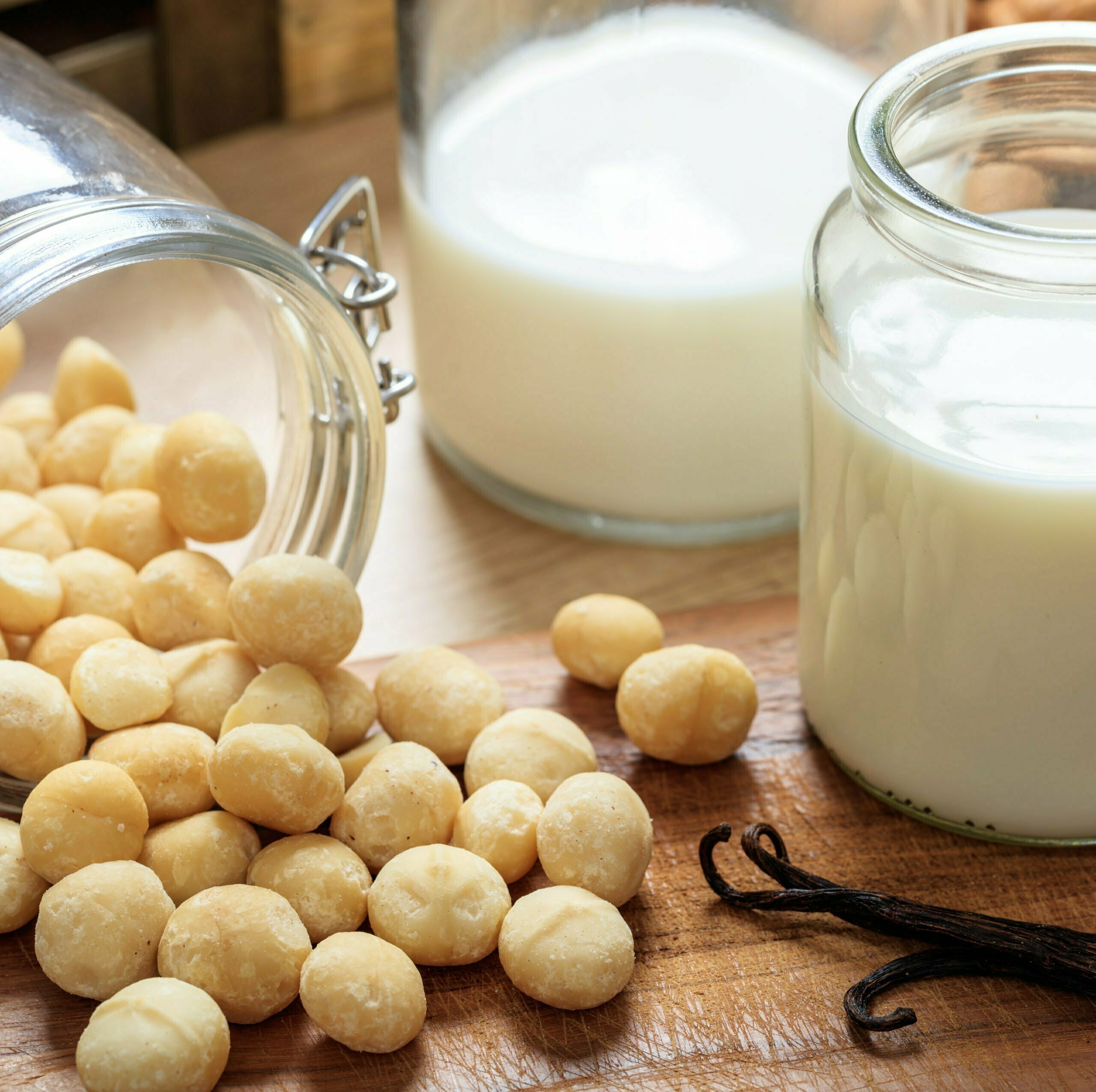 Macadamia milk on a wood table